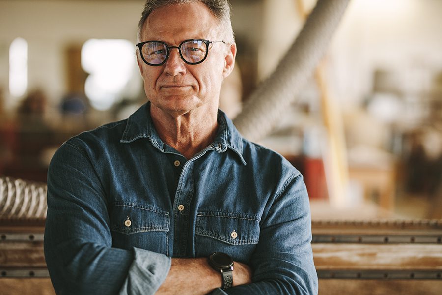 Specialized Business Insurance - Portrait of a Carpentry Workshop Owner in His Workshop